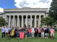 CPS-FR class standing in front of MIT Killian Court under blue skies